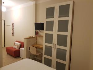 TV a/nebo společenská místnost v ubytování Residence Campo Rotondo