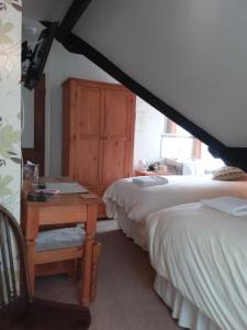 Postel nebo postele na pokoji v ubytování Boulmer Guest House