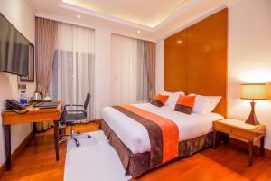 Postel nebo postele na pokoji v ubytování Alba Hotel Meru