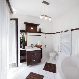 a bathroom with a tub and a sink and a toilet at Villa Cecile in Sopron +37 photos