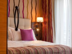Voodi või voodid majutusasutuse Suitenhotel Parco Paradiso toas