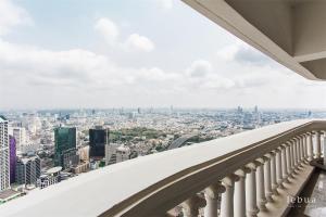 a view of the city from the balcony of a building at Tower Club at lebua in Bangkok