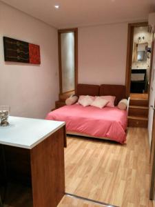 A bed or beds in a room at Estudio Nueva Numancia