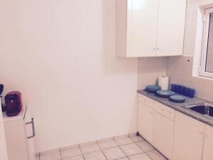 A kitchen or kitchenette at Korona Beach Apartments II