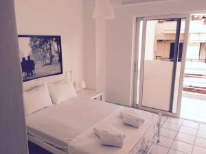 Posteľ alebo postele v izbe v ubytovaní Korona Beach Apartments II