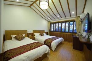 Voodi või voodid majutusasutuse Wuzhen On Memory Inn toas