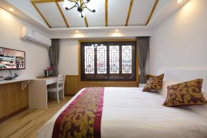 Voodi või voodid majutusasutuse Wuzhen On Memory Inn toas