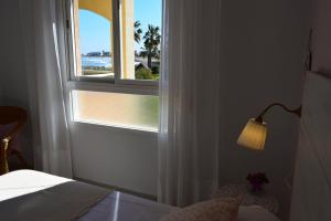 Posteľ alebo postele v izbe v ubytovaní Anacasa Bahia de Denia Les Marines AP2111