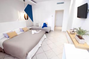 a living room with two beds and a couch at Hotel Rivage in Sorrento