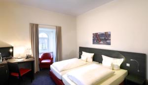 Postel nebo postele na pokoji v ubytování Hotel Bloemfontein