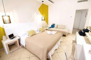 a living room with a table and a couch at Hotel Rivage in Sorrento
