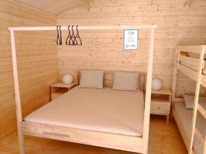 En eller flere senger på et rom på Camping Piccolo Paradiso