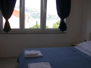 Posteľ alebo postele v izbe v ubytovaní Vis a Vis Apartments