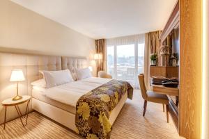 Voodi või voodid majutusasutuse Suitenhotel Parco Paradiso toas