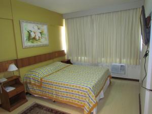 Postel nebo postele na pokoji v ubytování Itaimbé Palace Hotel