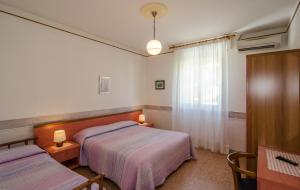 Postel nebo postele na pokoji v ubytování Hotel Ambra