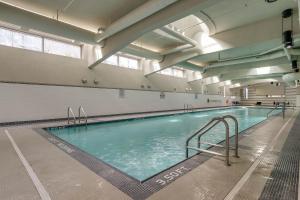 a large swimming pool in a large building at The Altitude in Vancouver