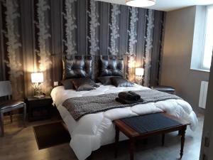 מיטה או מיטות בחדר ב-Le Loft De Teddy