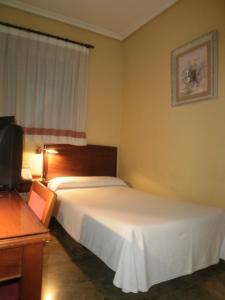 Postel nebo postele na pokoji v ubytování Hotel Isabel