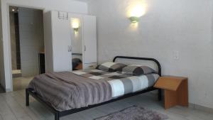 Postel nebo postele na pokoji v ubytování Hôtel - Gîte de Pressins