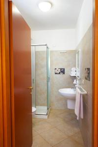 a bathroom with a shower and a sink at Agriturismo Masseria Terra D'Otranto in Otranto