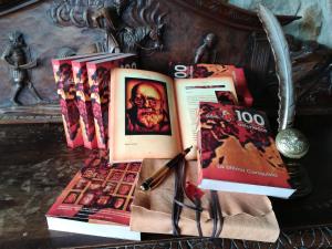 a pile of books sitting on top of a table at Caseria la Infiesta in Caleao