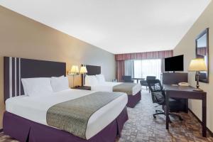 Voodi või voodid majutusasutuse Days Inn By Wyndham Bellingham WA toas