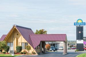 a rendering of a day inn building with a garage at Days Inn by Wyndham Niles in Niles