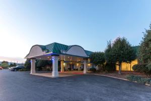 a building with a parking lot in front of it at Days Inn by Wyndham Luray Shenandoah in Luray