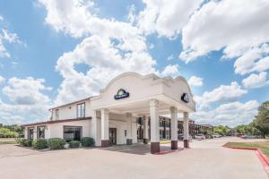 a rendering of the front of a building at Days Inn by Wyndham Bryan College Station in College Station