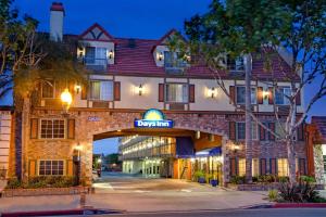 a hotel with a sign that reads durham at Days Inn by Wyndham Los Angeles LAX/ Redondo&ManhattanBeach in Lawndale