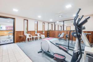 a fitness room with a gym with tread machines at Days Inn by Wyndham Sturgis in Sturgis