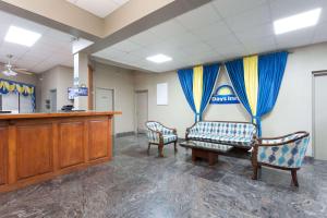 a waiting room at a hospital with two chairs at Days Inn by Wyndham Orangeburg in Orangeburg