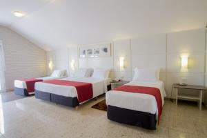 Cama o camas de una habitación en Hotel Confiance Soho Batel