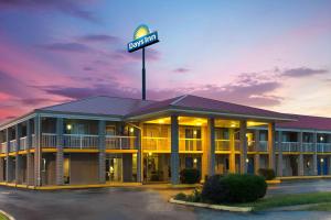 a hotel with a sign on top of it at Days Inn by Wyndham Richmond in Richmond