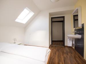 Ένα ή περισσότερα κρεβάτια σε δωμάτιο στο Hotel Gregory
