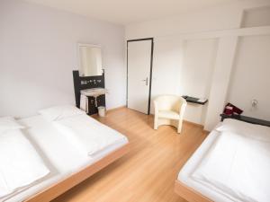 Ένα ή περισσότερα κρεβάτια σε δωμάτιο στο Hotel Gregory