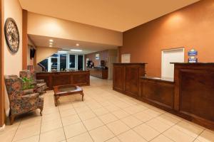 a large lobby with a waiting area with a waiting room at Days Inn by Wyndham Oklahoma City Fairground in Oklahoma City