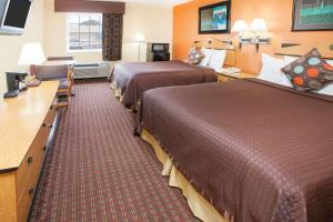 เตียงในห้องที่ Days Inn by Wyndham Alma ARKANSAS