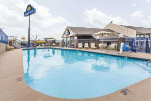 a large swimming pool at a hotel at Days Inn by Wyndham Nashville N Opryland/Grand Ole Opry in Nashville