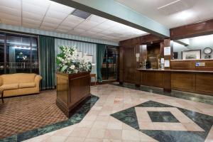 a lobby with a waiting area with a waiting room at Days Inn by Wyndham Petersburg/South Fort Lee in Petersburg