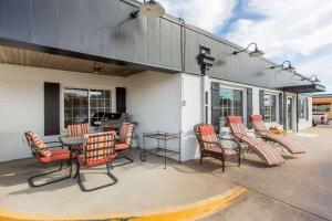 a group of chairs and a table on a patio at Days Inn by Wyndham Pierre in Pierre