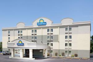 
a large building with a large sign on top of it at Days Inn by Wyndham Wilkes Barre in Wilkes-Barre
