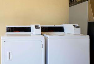 two appliances sitting on top of a refrigerator at Days Inn by Wyndham Centerville in Centerville +7 photos