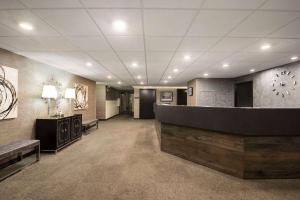 a lobby with a waiting room with a reception desk at Days Hotel by Wyndham University Ave SE in Minneapolis