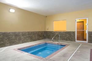 a large swimming pool in a room with a sink at Days Inn by Wyndham Hurricane/Zion National Park Area in Hurricane