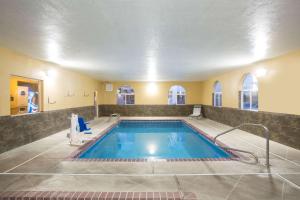 a large swimming pool in a room with at Days Inn by Wyndham Hurricane/Zion National Park Area in Hurricane