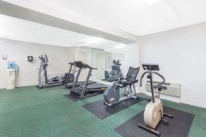 a gym with several exercise bikes in a room at Days Inn by Wyndham Arlington Pentagon in Arlington