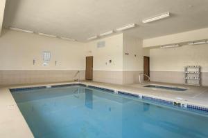 a large swimming pool in a large room at Days Inn by Wyndham Jefferson City in Jefferson City