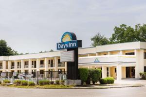 a day inn sign in front of a building at Days Inn by Wyndham Little River in Little River